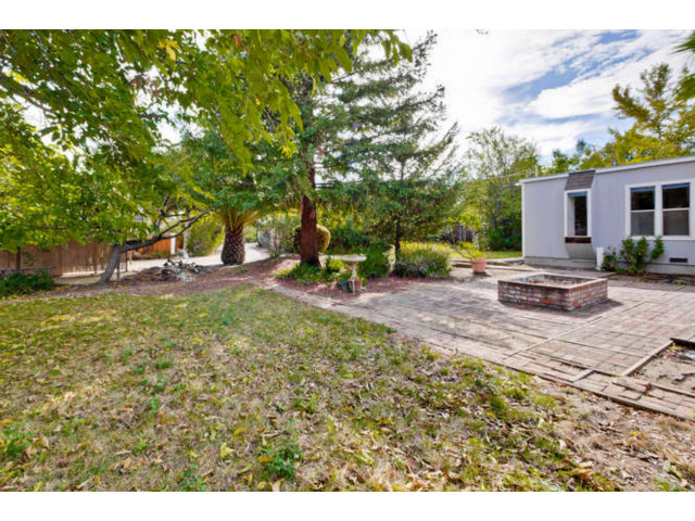 22343 McClellan Road Cupertino, CA 95014 - Photo 3 of 15 a backyard of a house with table and chairs