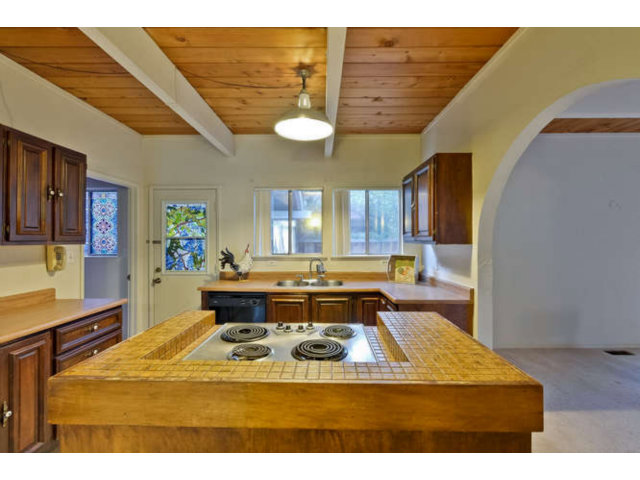 22343 McClellan Road Cupertino, CA 95014 - Photo 5 of 15 a view of a living room and kitchen