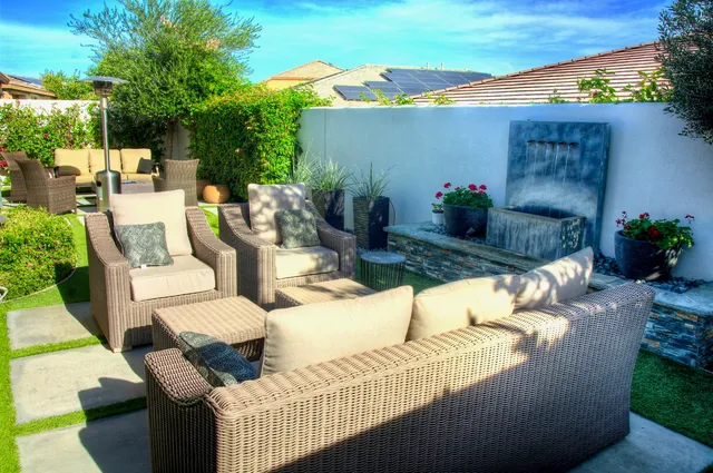 a view of a patio with couches and potted plants