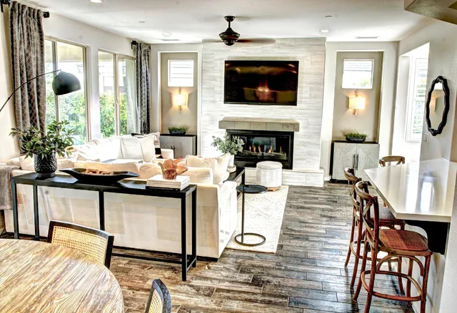 a living room with fireplace furniture and a flat screen tv