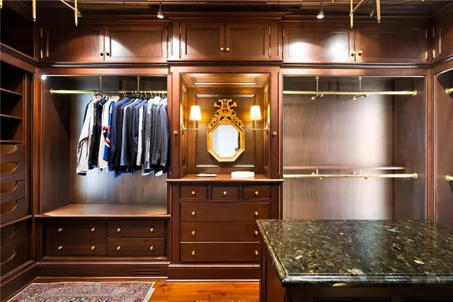 a spacious bedroom with a bed and a couch