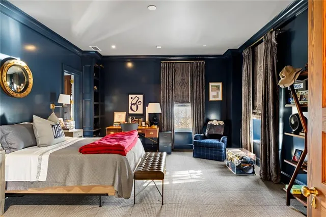 a dining room with glass table and chairs