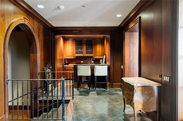 a view of entryway and kitchen