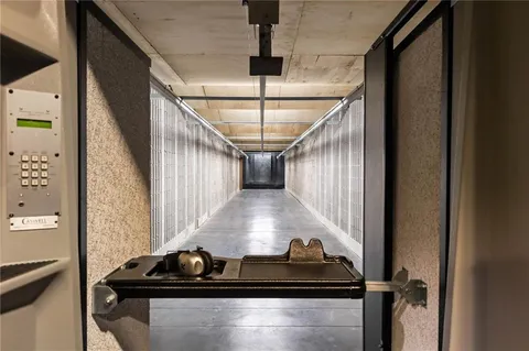 a kitchen with stainless steel appliances kitchen island granite countertop a stove and a refrigerator