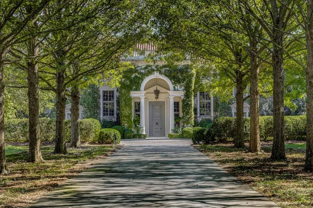 a view of a house with a garden
