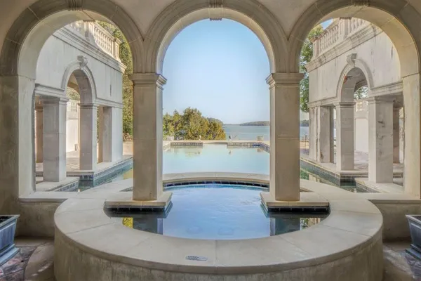 a aerial view of a house with swimming pool and sitting space