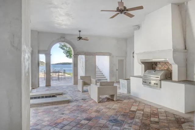 an aerial view of a house with a lake view