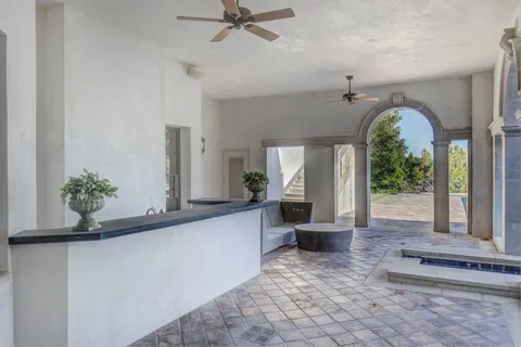 a view of a house with a yard and a garden