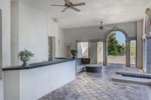a view of a house with a yard and a garden