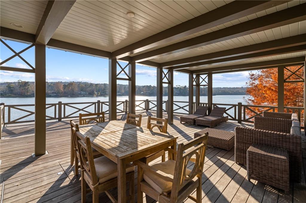 1405 Big Eddy Court Columbus, GA 31904 - Photo 48 of 53 a view of a patio with a table chairs and wooden floor
