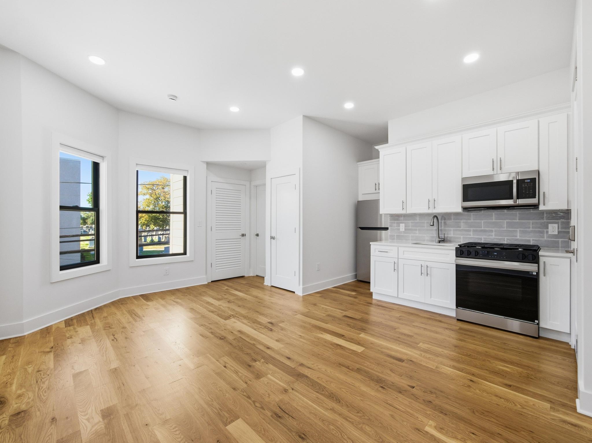 a view of a kitchen with a sink cabinets and a window