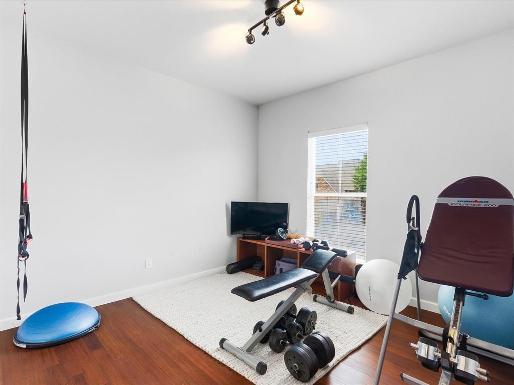 1615 Roma Lane Allen, TX 75013 - Photo 23 of 36 Bright Bedroom featuring wood-finish flooring, white walls, and a window with horizontal blinds