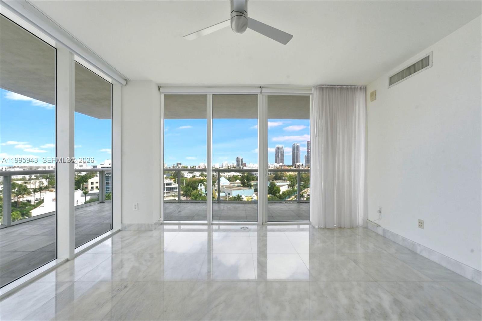 450 Alton Road, Unit 910 Miami Beach, FL 33139 - Photo 11 of 59 a view of an empty room with window