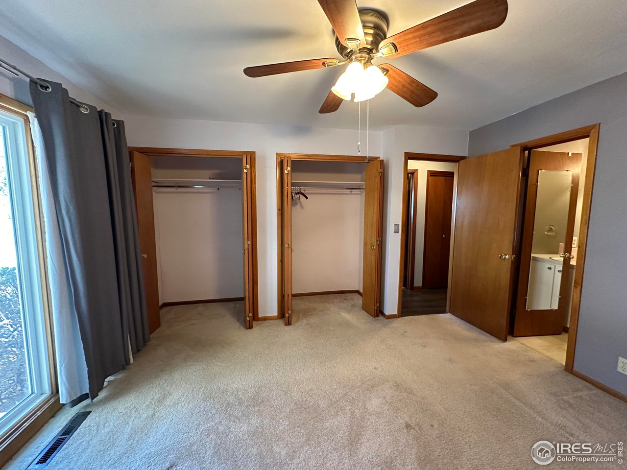 680 Clinic Drive Limon, CO 80828 - Photo 11 of 24 an empty room with closet and a ceiling fan
