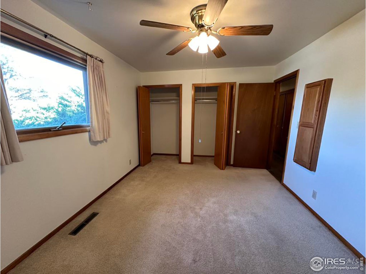 680 Clinic Drive Limon, CO 80828 - Photo 15 of 24 an empty room with windows and fan