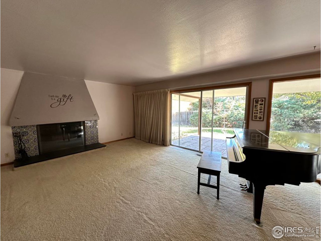 680 Clinic Drive Limon, CO 80828 - Photo 3 of 24 a living room with furniture a fireplace and large windows