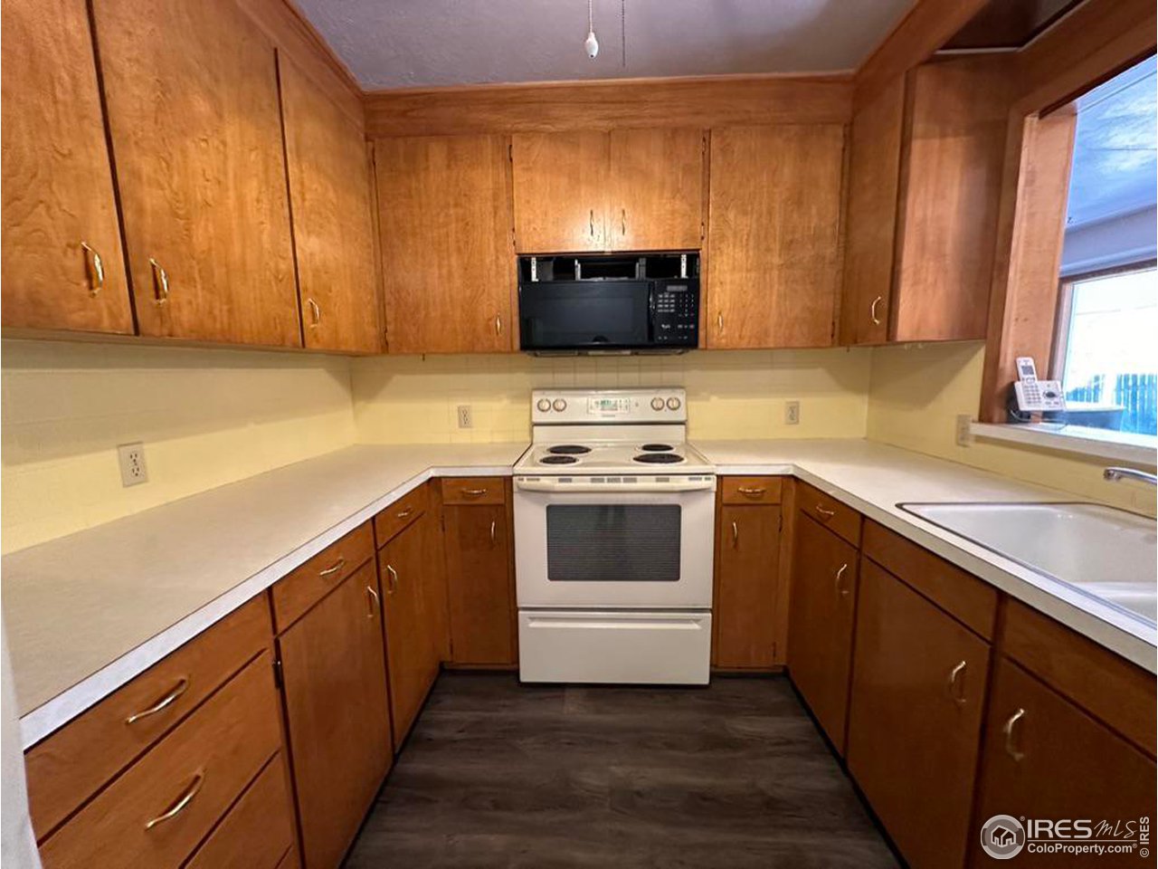 680 Clinic Drive Limon, CO 80828 - Photo 9 of 24 a kitchen with a sink cabinets and a window