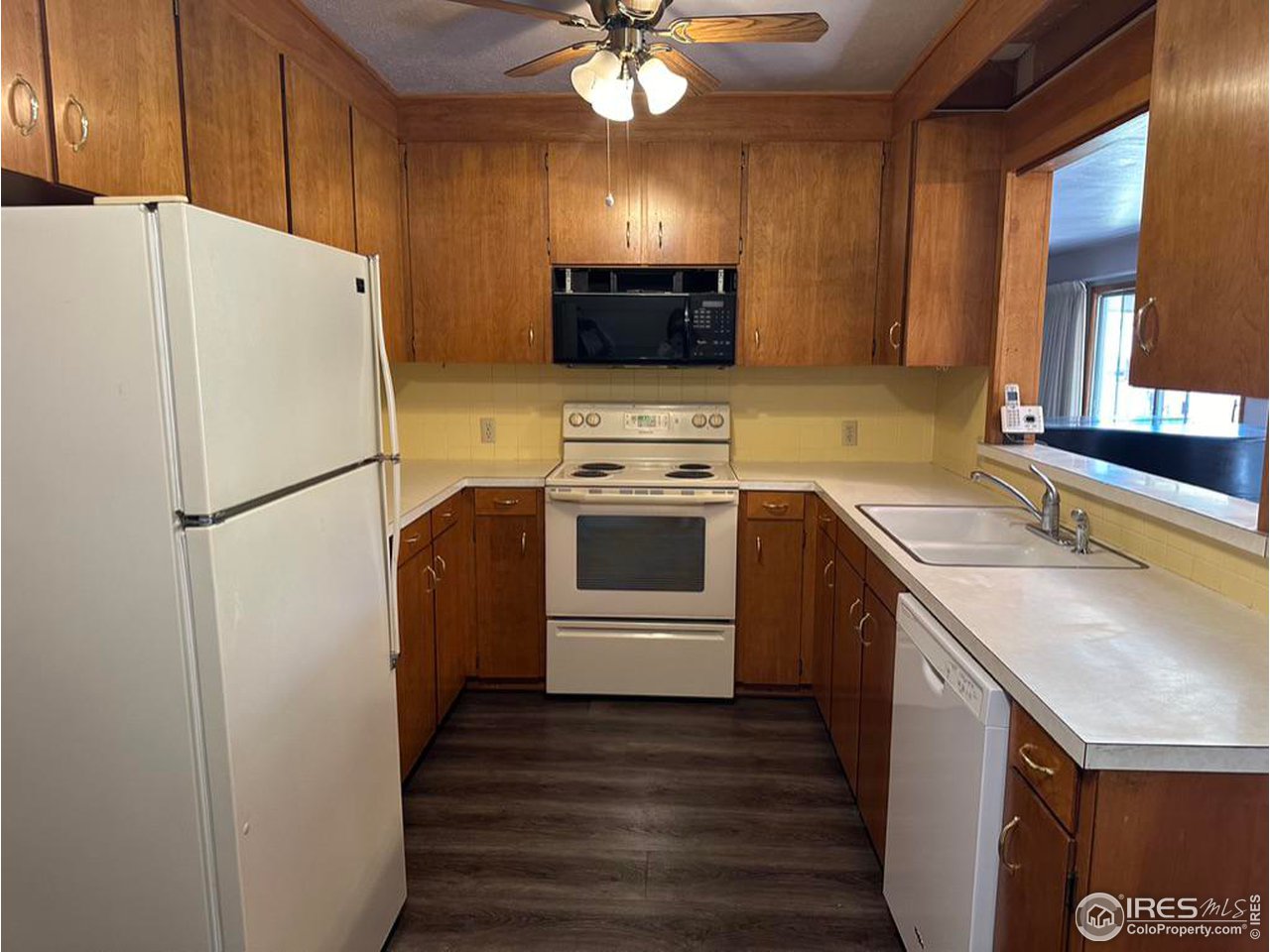 680 Clinic Drive Limon, CO 80828 - Photo 10 of 24 a kitchen with a sink a refrigerator and a stove