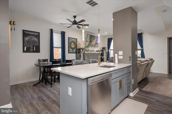 a kitchen with a sink and stove