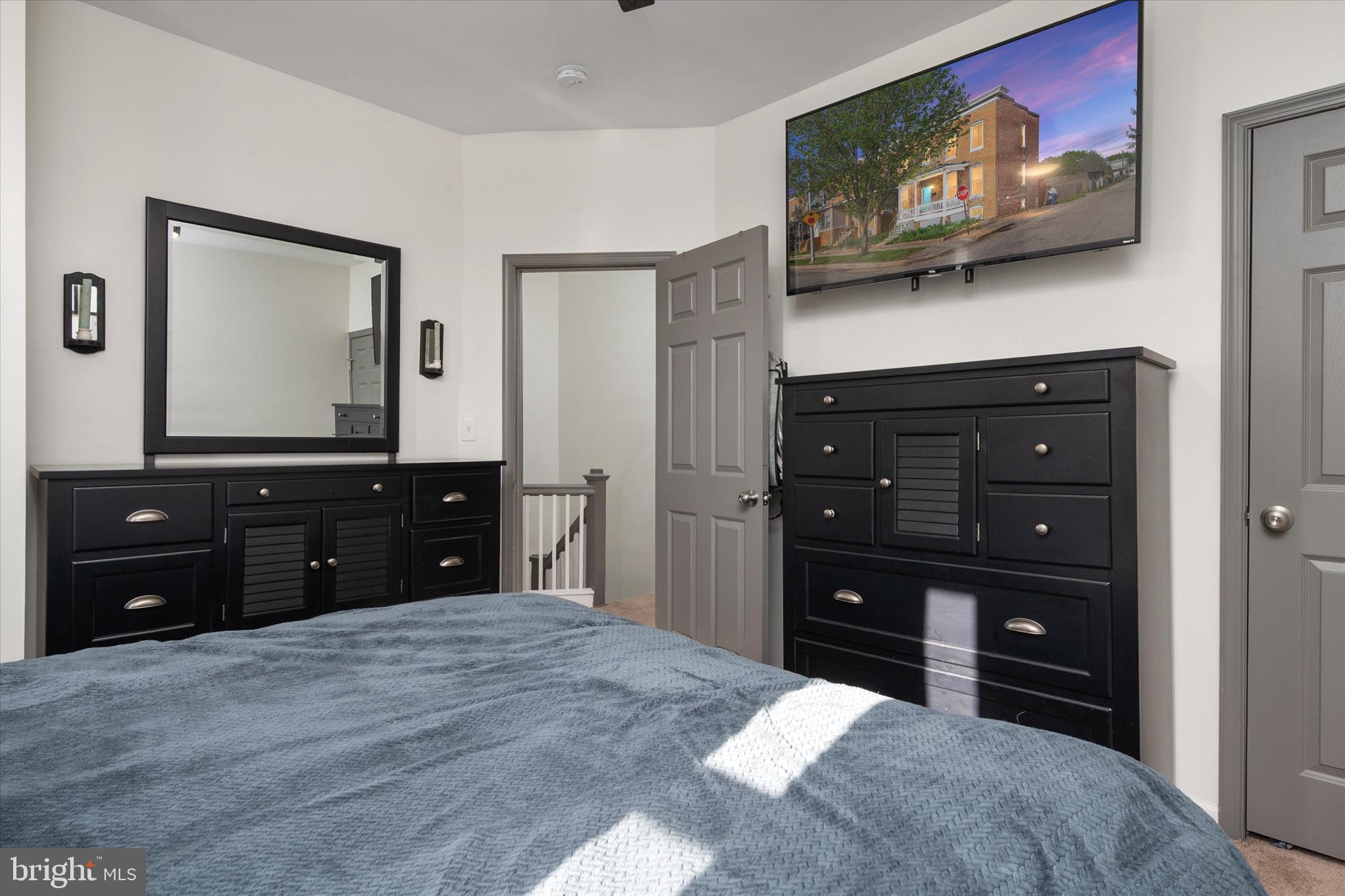 3714 5th Street Baltimore, MD 21225 - Photo 16 of 35 a room with a bed and a television