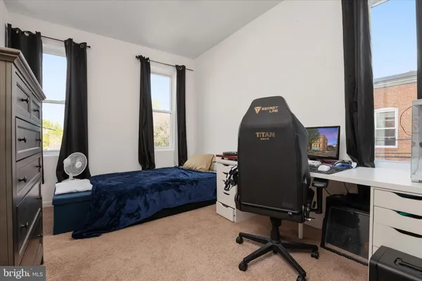 a living room with a couch and a window