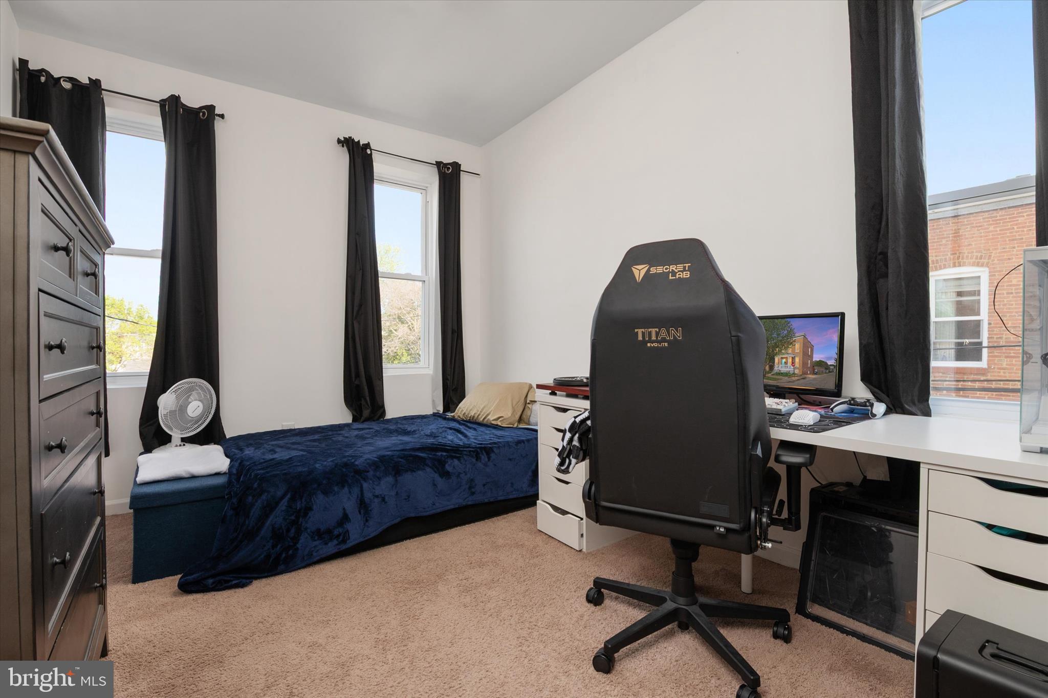 3714 5th Street Baltimore, MD 21225 - Photo 17 of 35 a living room with a couch and a window