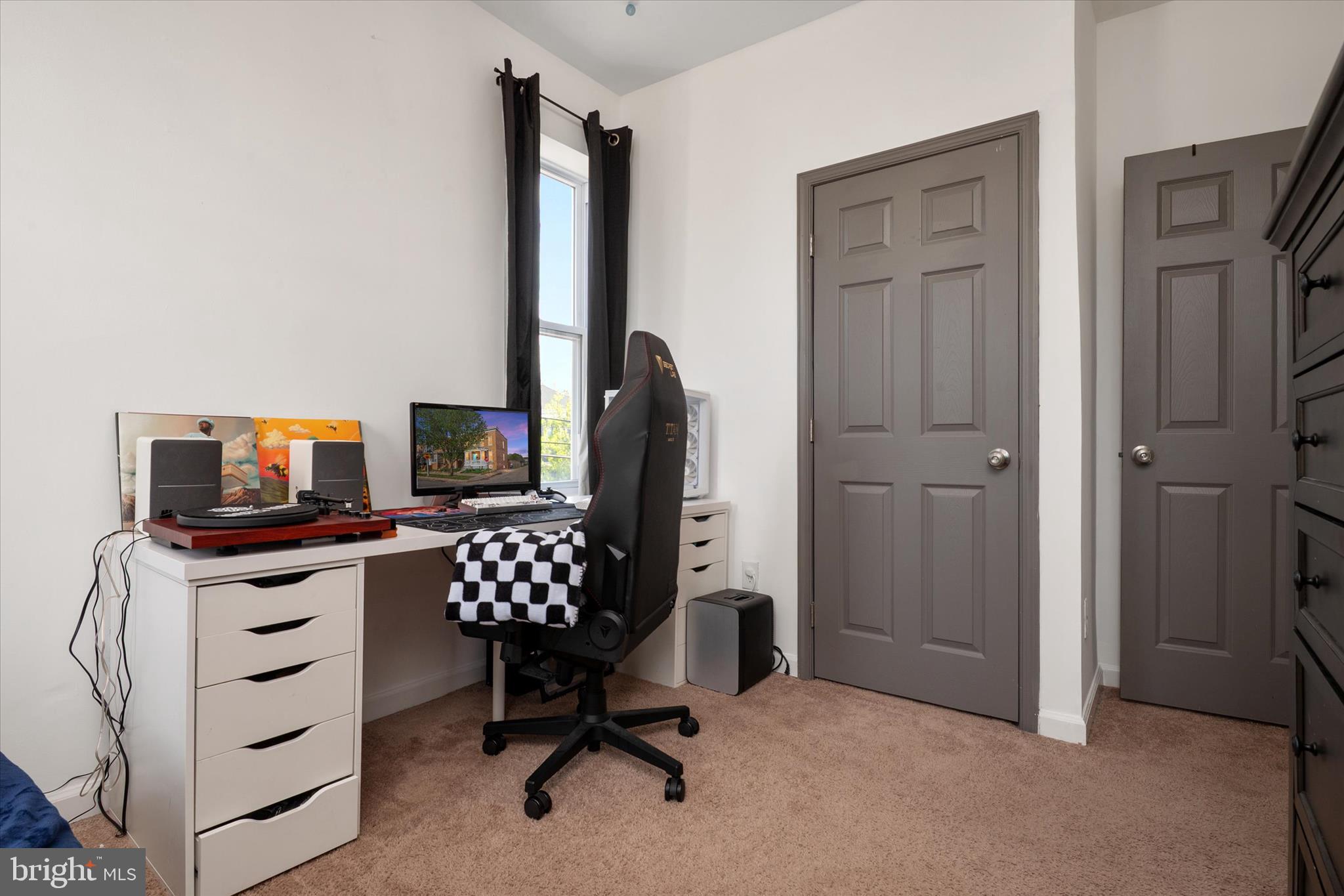 3714 5th Street Baltimore, MD 21225 - Photo 18 of 35 a view of a workspace with furniture and a window