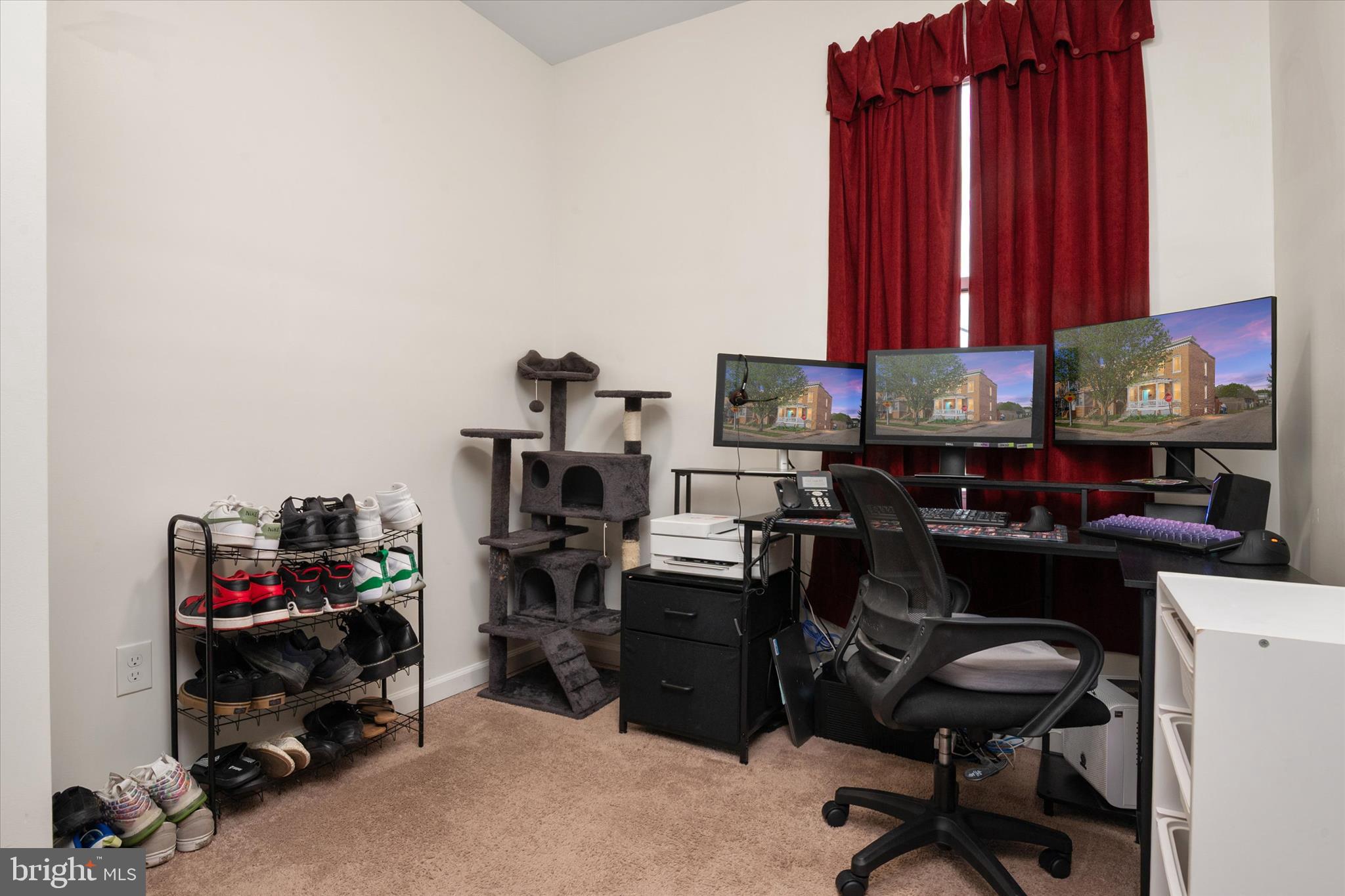 3714 5th Street Baltimore, MD 21225 - Photo 19 of 35 a view of a workspace with furniture and a gate