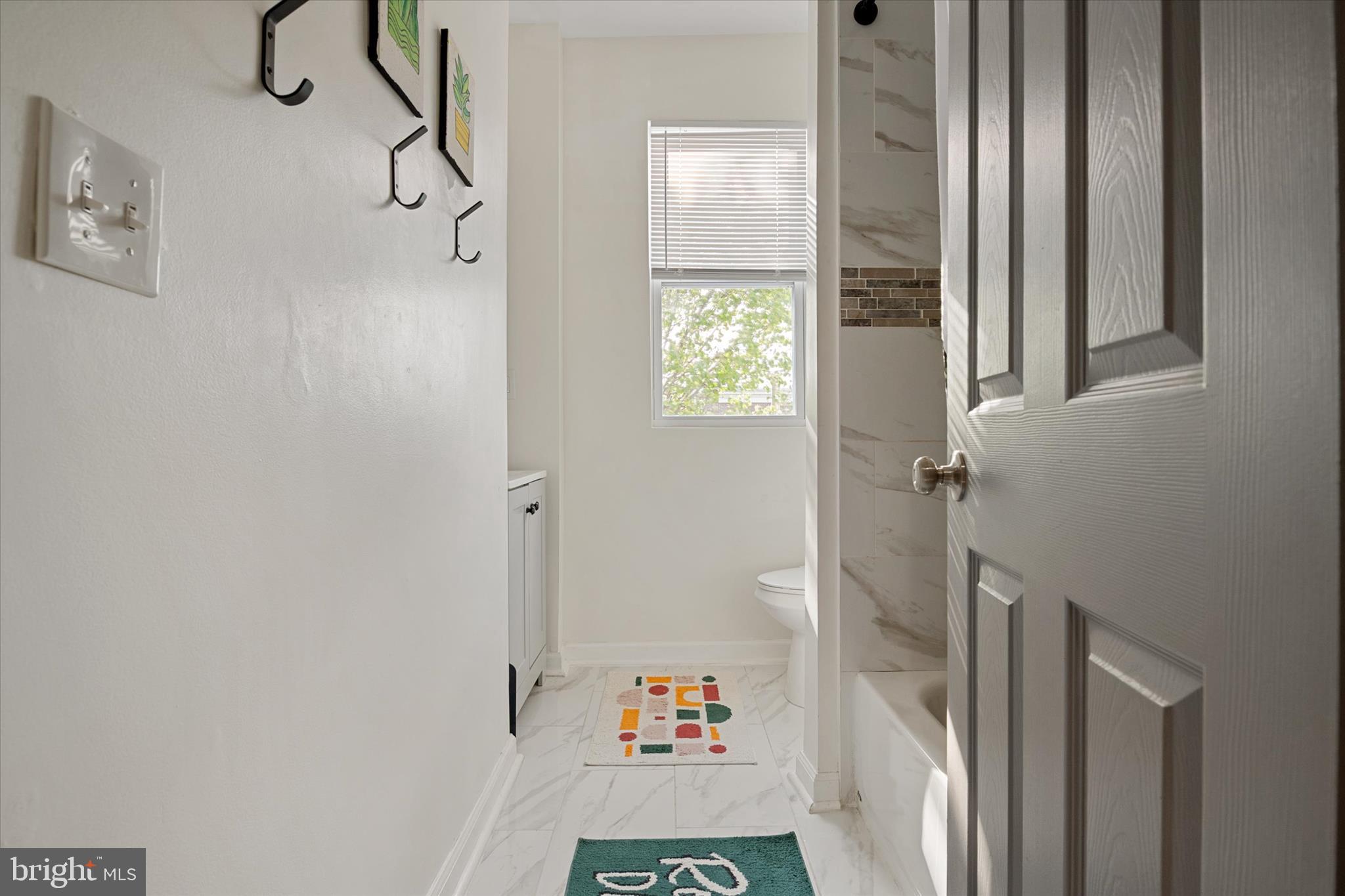 3714 5th Street Baltimore, MD 21225 - Photo 20 of 35 a walk in closet with wooden floor