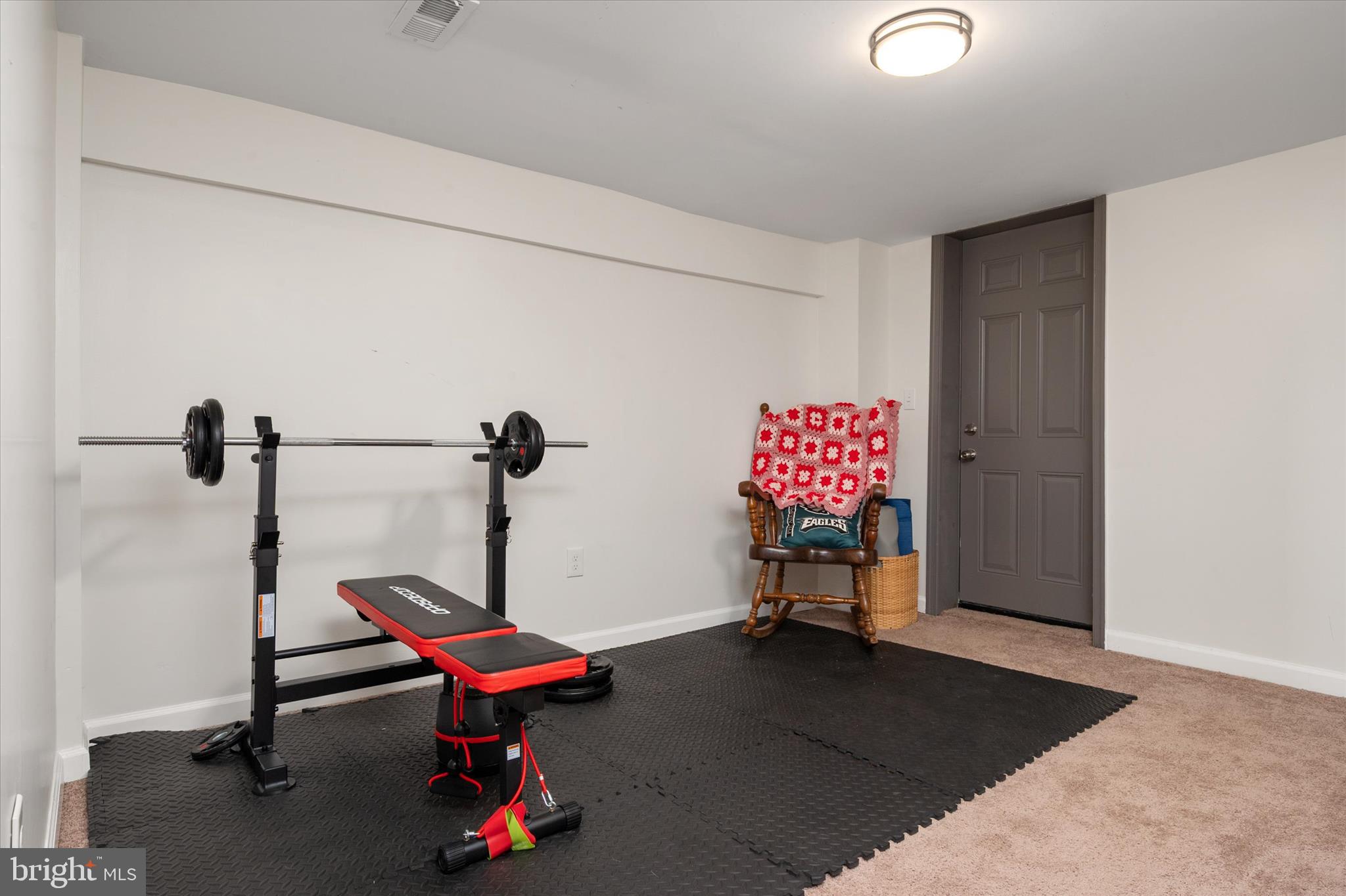 3714 5th Street Baltimore, MD 21225 - Photo 24 of 35 a living room with furniture and a chandelier