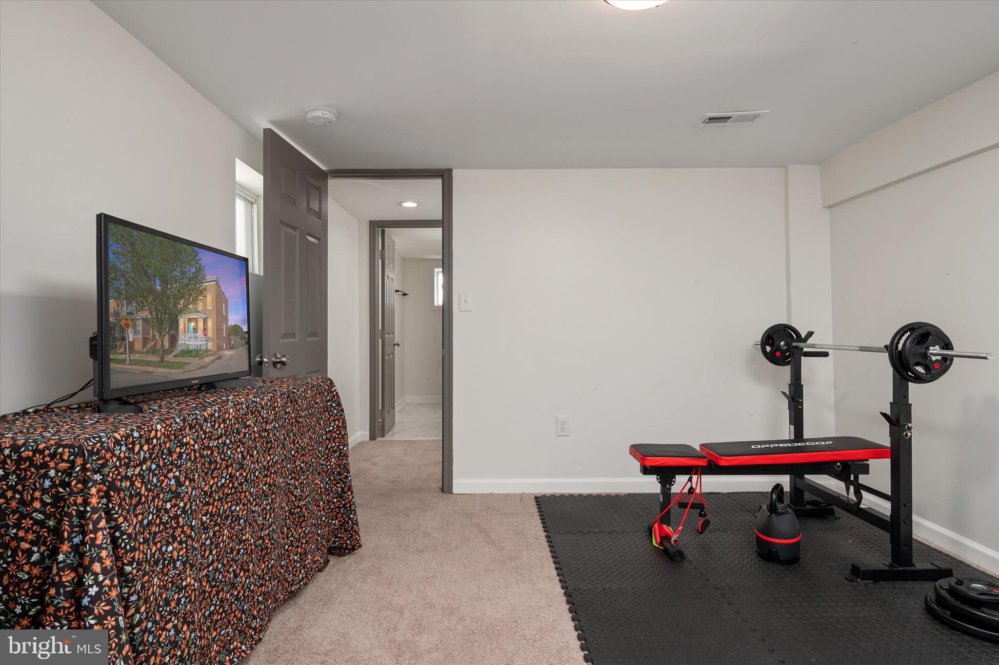 3714 5th Street Baltimore, MD 21225 - Photo 25 of 35 a bedroom with a bed and a dresser