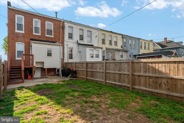 a view of a front of a house with a yard
