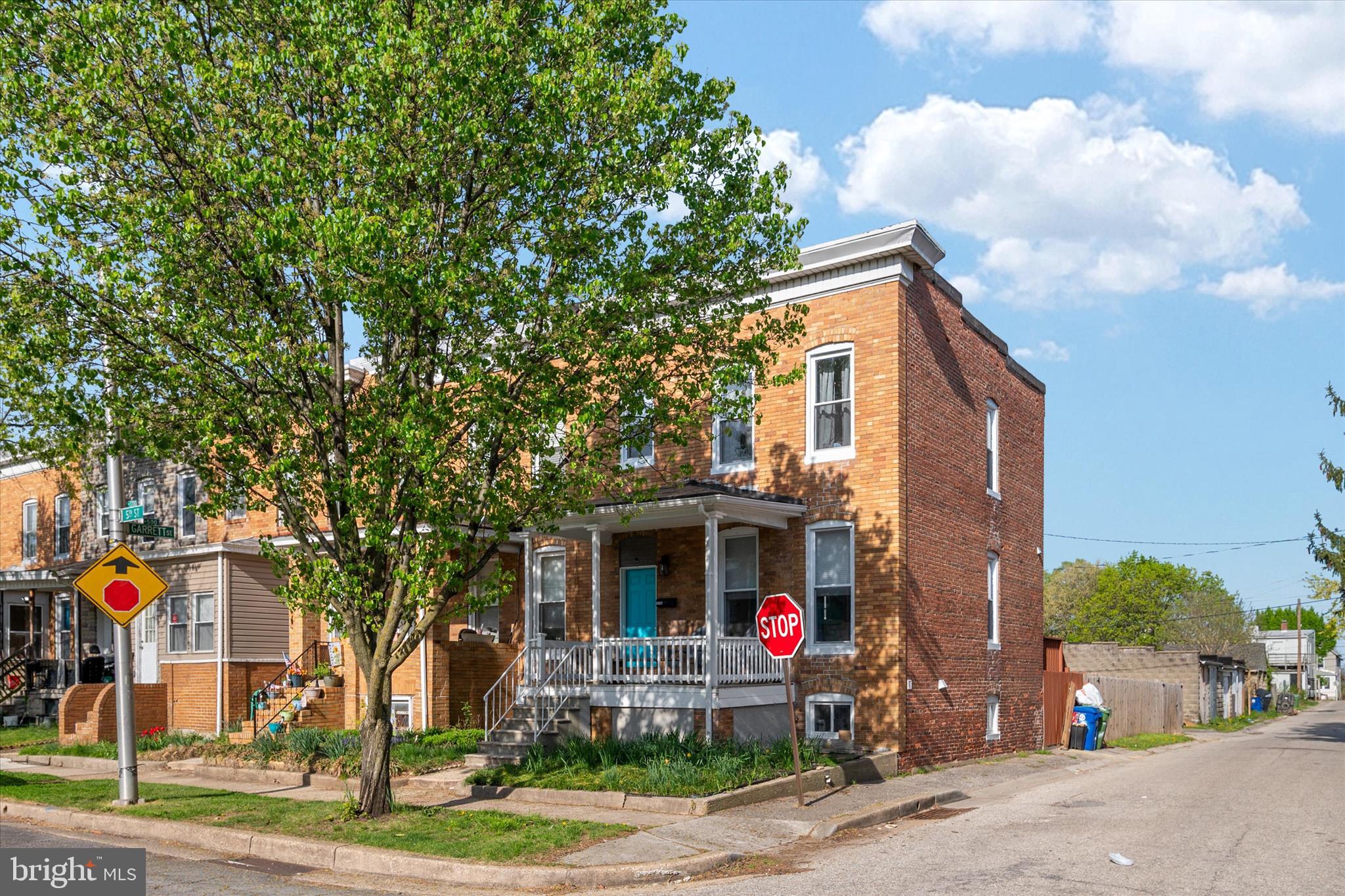 3714 5th Street Baltimore, MD 21225 - Photo 33 of 35 a front view of a house with garden and plants