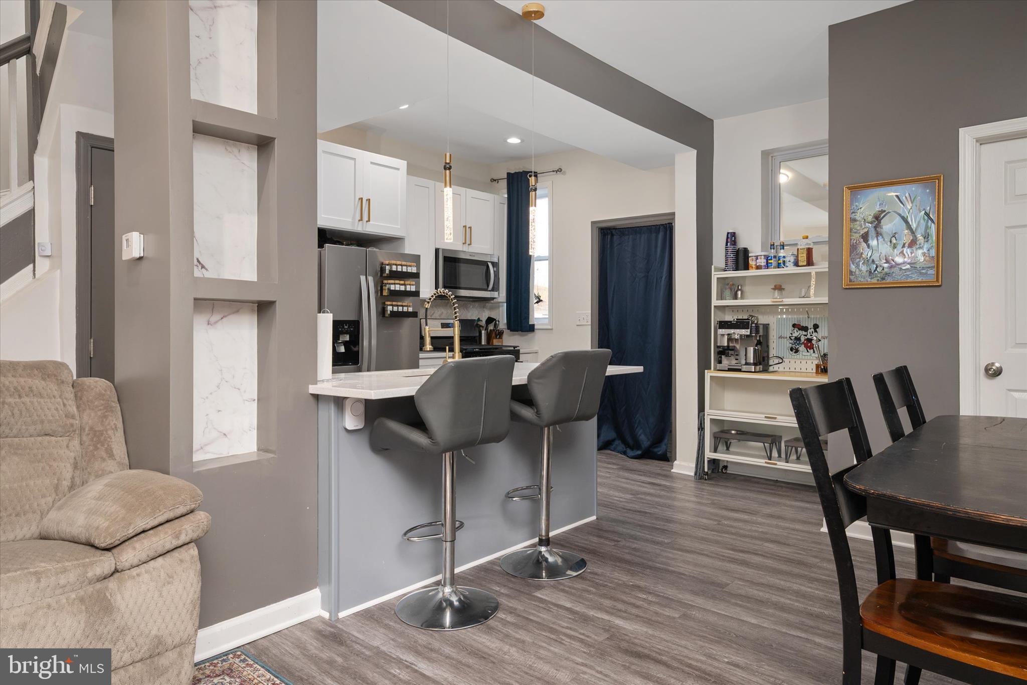 3714 5th Street Baltimore, MD 21225 - Photo 10 of 35 a view of a dining room with furniture and wooden floor