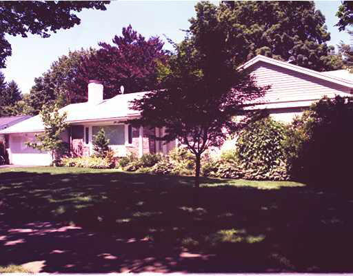a view of a house with a tree