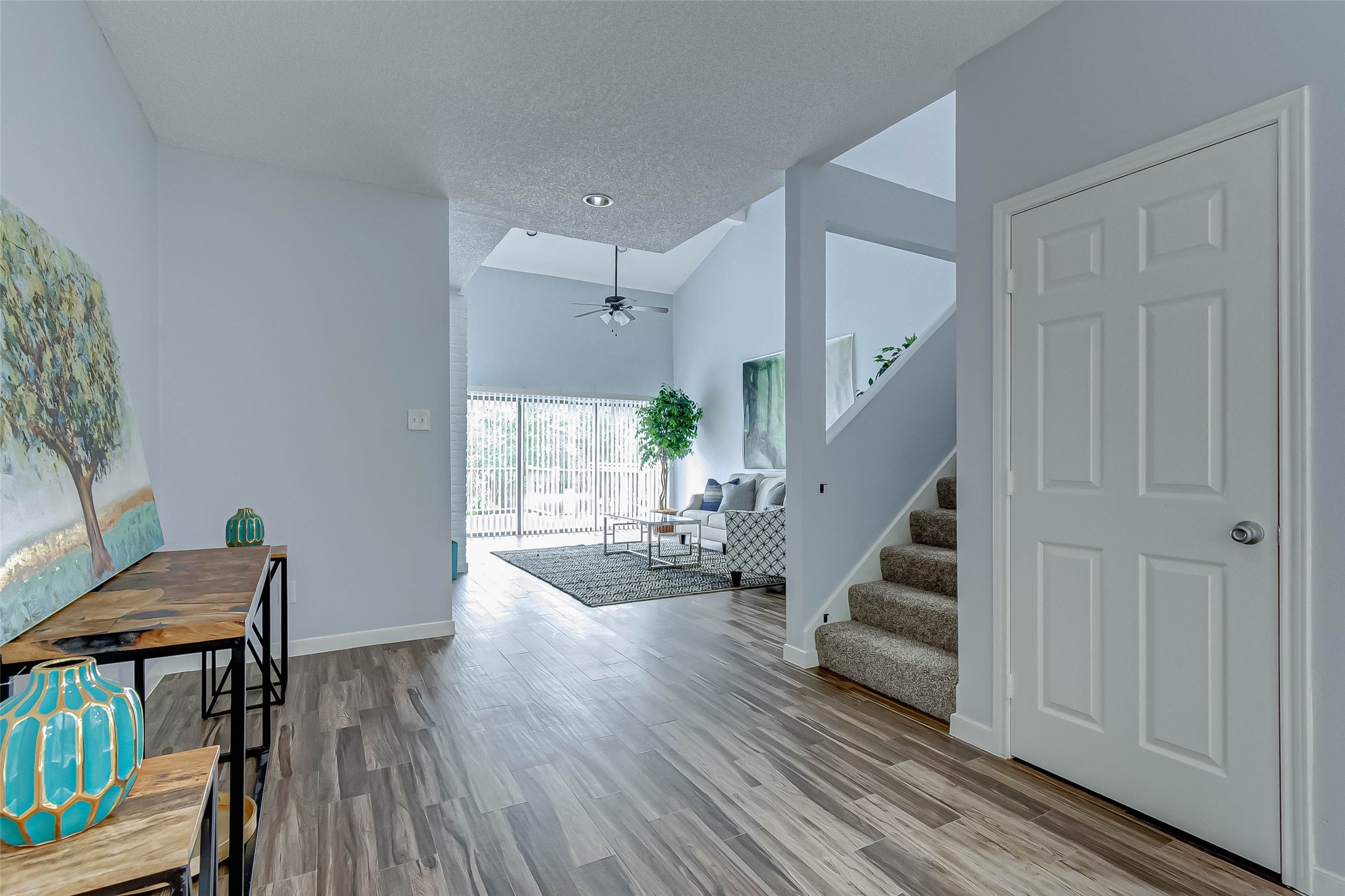 395 Rancho Bauer Drive Houston, TX 77079 - Photo 13 of 50 a living room with furniture and a wooden floor