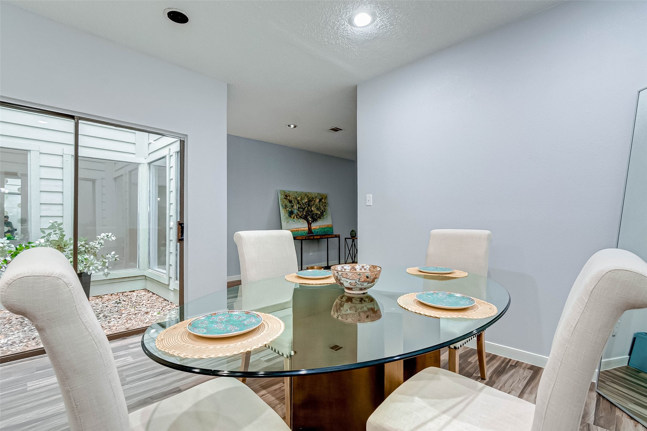 395 Rancho Bauer Drive Houston, TX 77079 - Photo 29 of 50 a view of a dining room with furniture and wooden floor