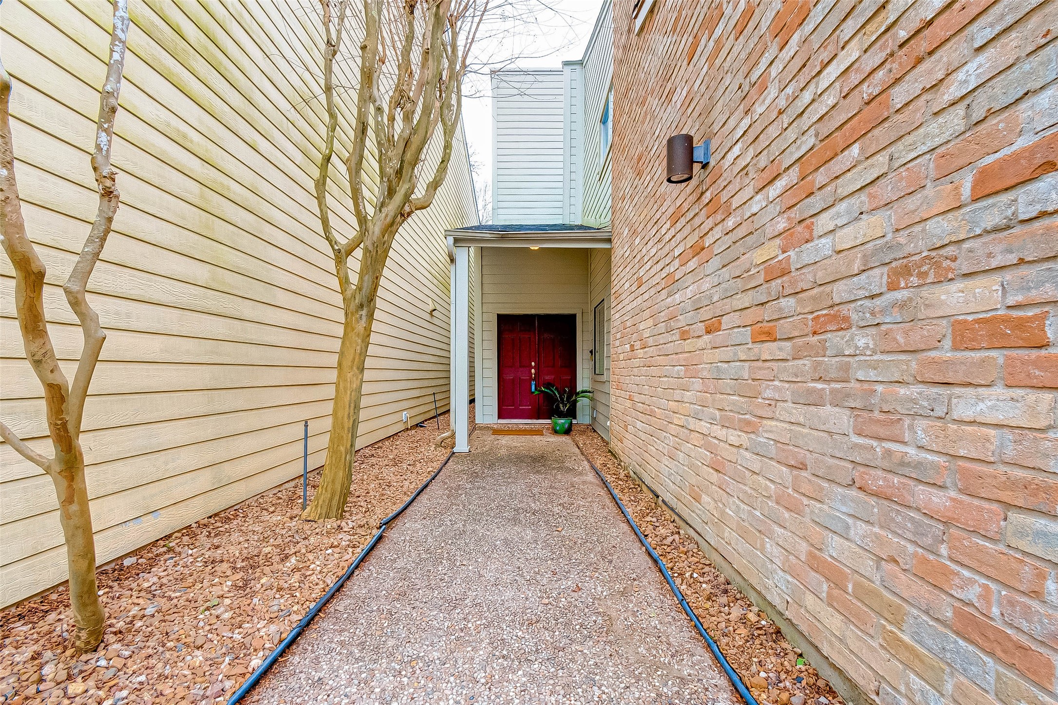 395 Rancho Bauer Drive Houston, TX 77079 - Photo 4 of 50 a view of a pathway with a house
