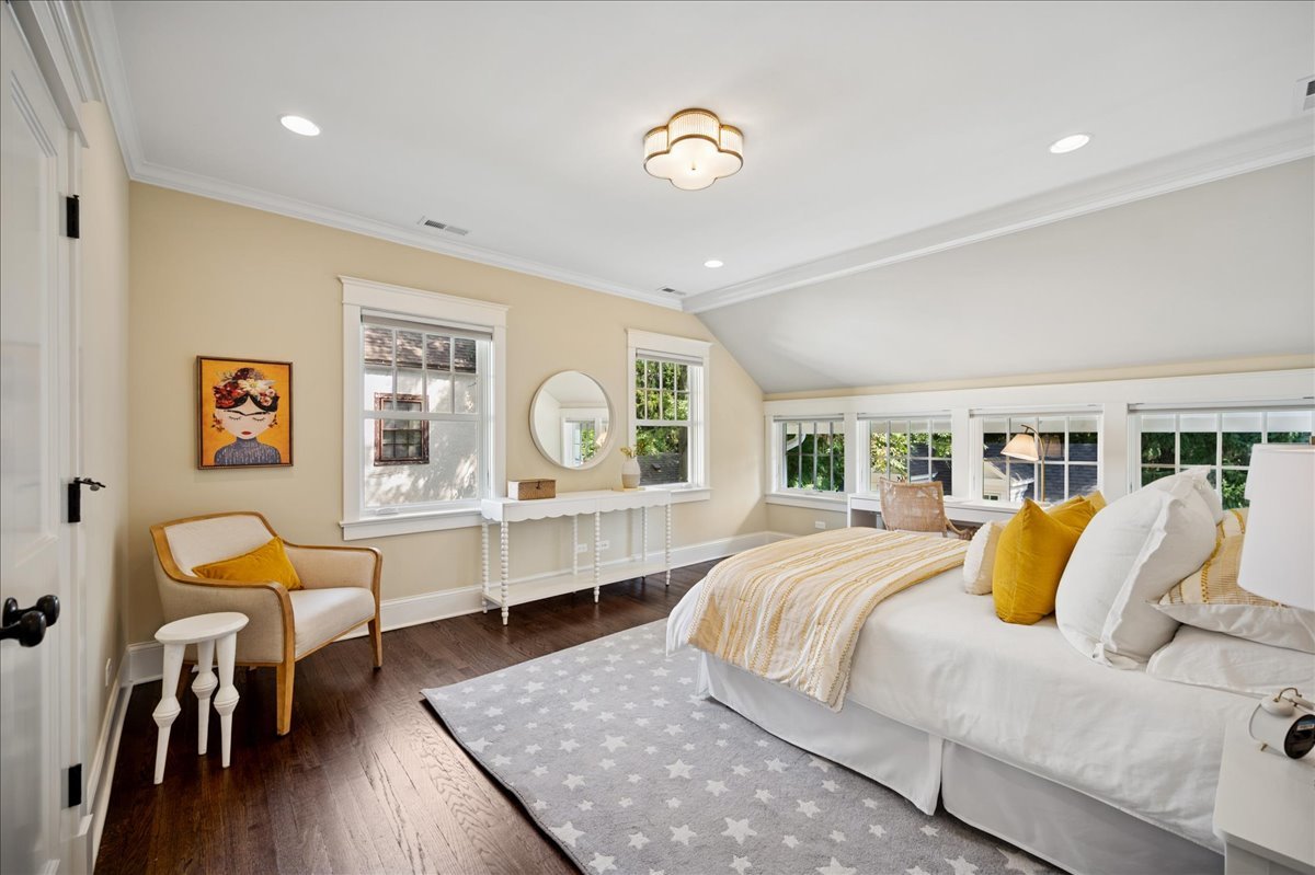 519 Cedar Street Winnetka, IL 60093 - Photo 21 of 36 a bedroom with a bed and wooden floor