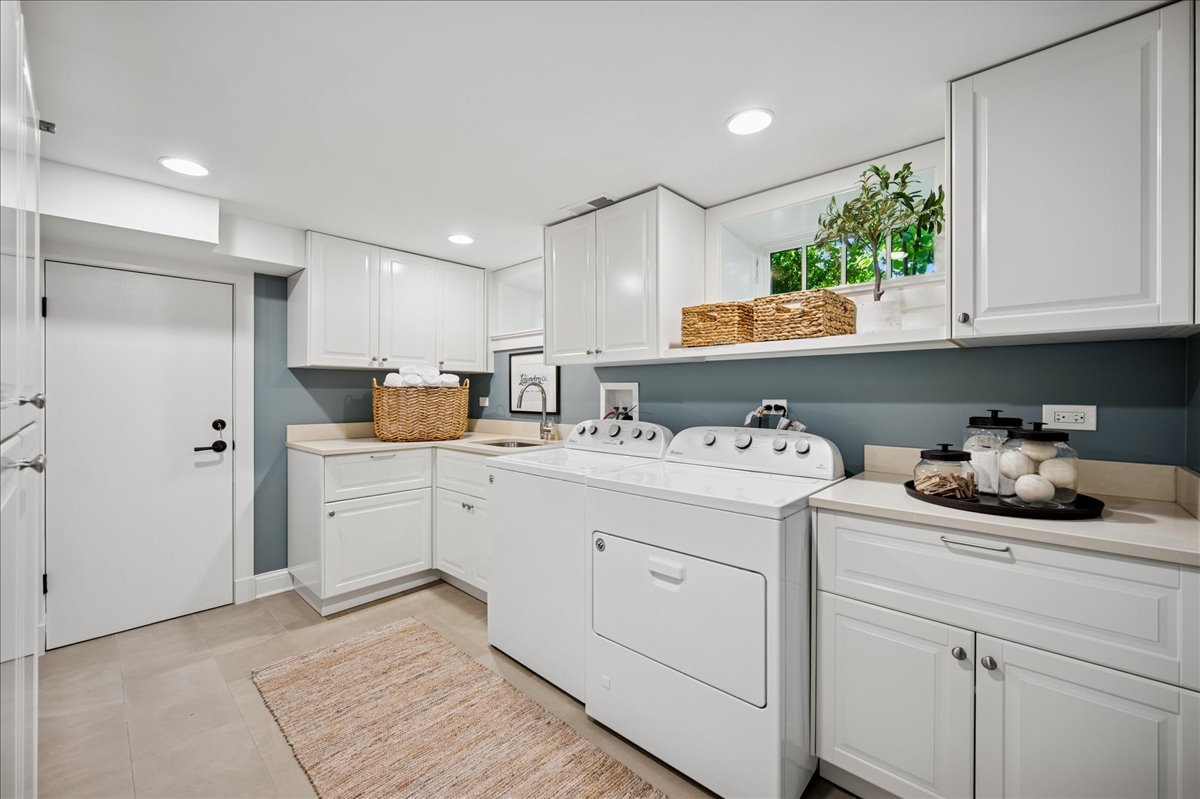 519 Cedar Street Winnetka, IL 60093 - Photo 29 of 36 a kitchen with sink refrigerator and cabinets