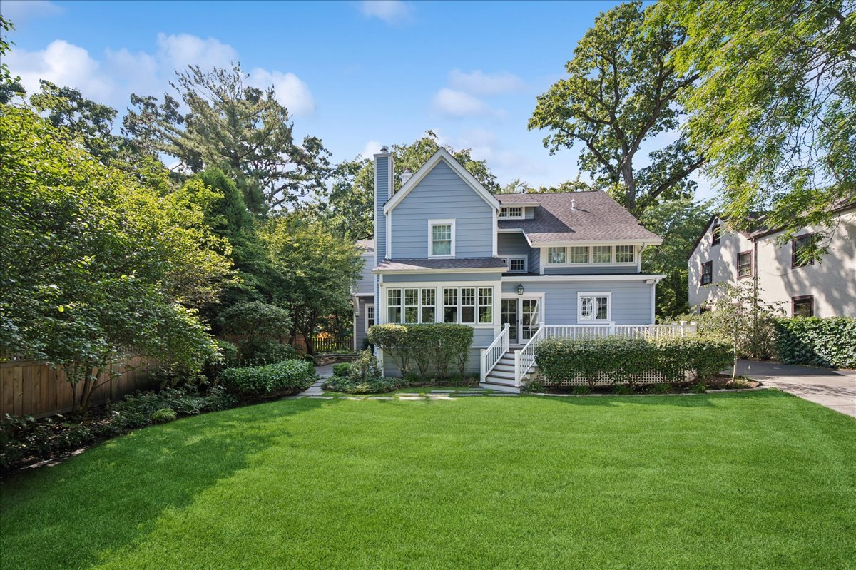 519 Cedar Street Winnetka, IL 60093 - Photo 30 of 36 a front view of a house with a yard and trees