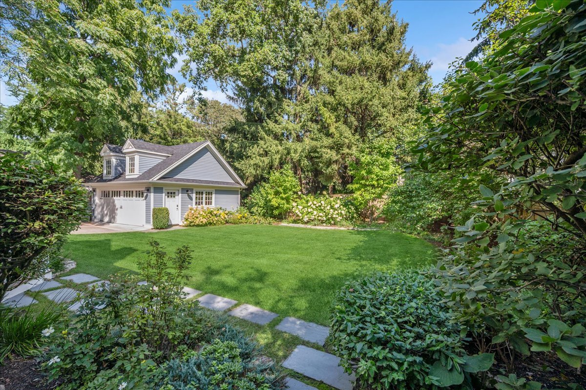 519 Cedar Street Winnetka, IL 60093 - Photo 33 of 36 a front view of a house with yard and green space