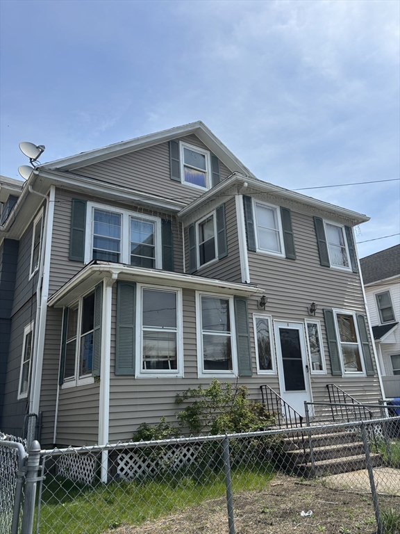 11-15 Groveland Street Springfield, MA 01108 - Photo 1 of 4 a front view of a house with a yard