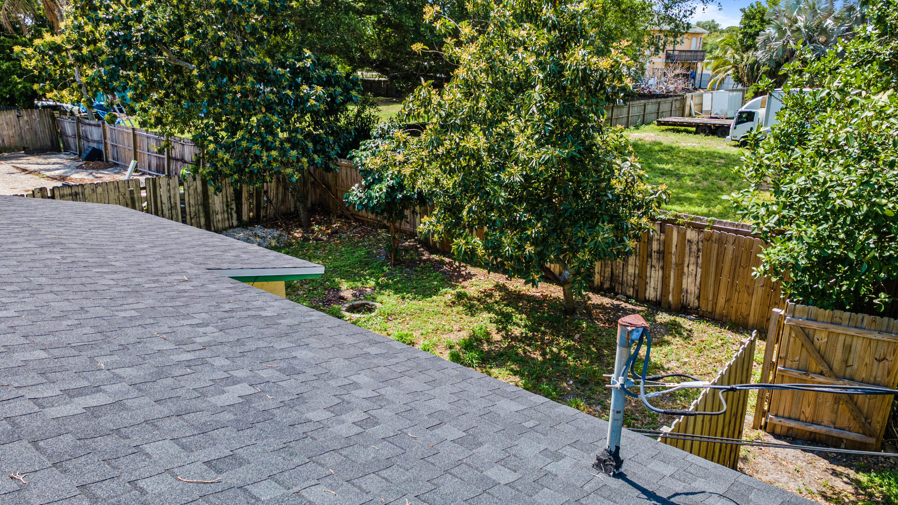 4453 Stevens Road Lake Worth Beach, FL 33461 - Photo 17 of 67 a view of a pathway with a bench in front of house