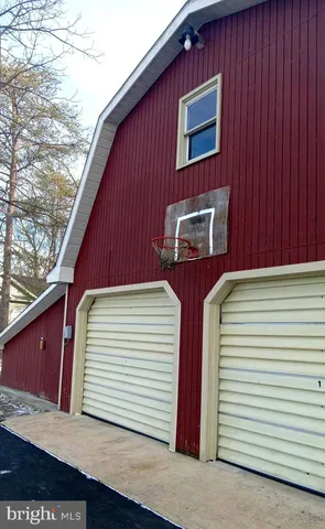 a bathroom with a shower curtain and a toilet