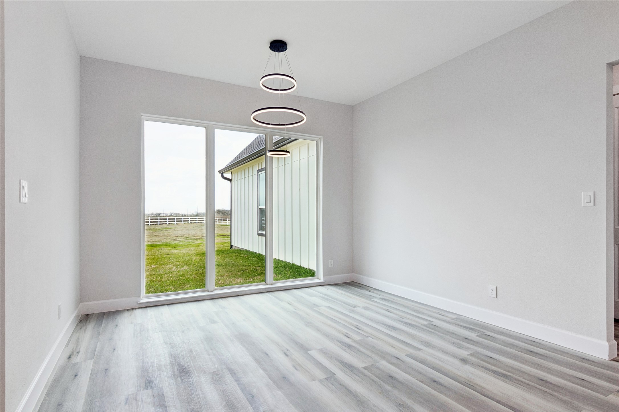 5766 Ward Bend Road Sealy, TX 77474 - Photo 15 of 45 a view of room with window and hardwood floor