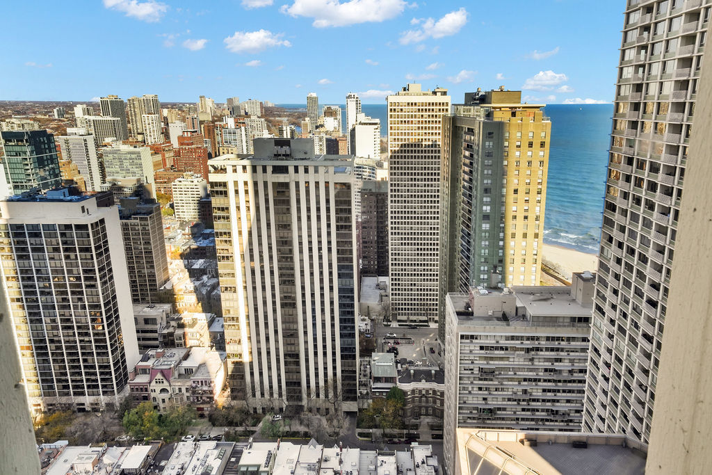 100 East Walton Street, Unit 17C Chicago, IL 60611 - Photo 14 of 21 a view of a city with tall buildings