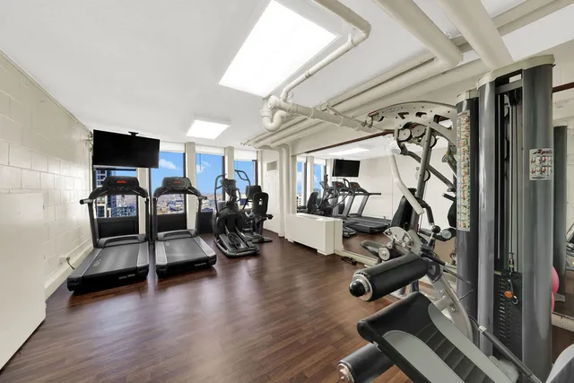 a view of a livingroom with hardwood floor and a couch