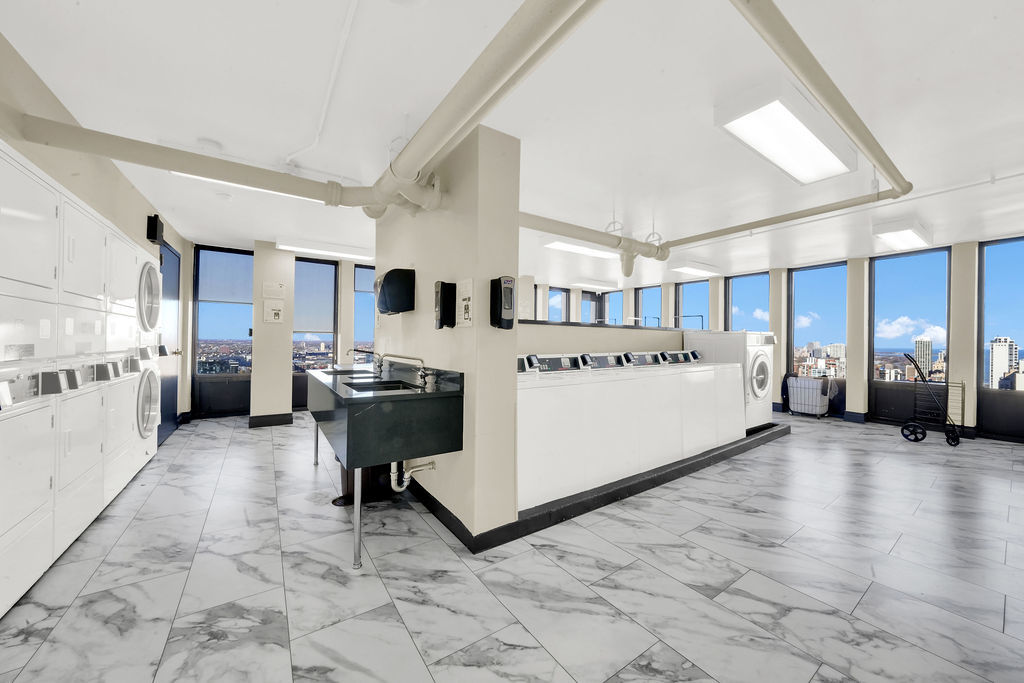 100 East Walton Street, Unit 17C Chicago, IL 60611 - Photo 17 of 21 a large white room with a large window