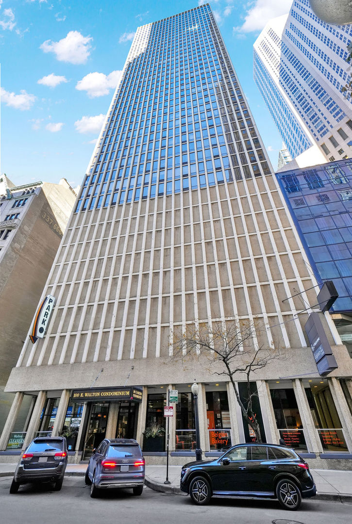 100 East Walton Street, Unit 17C Chicago, IL 60611 - Photo 2 of 21 a car parked in front of a building